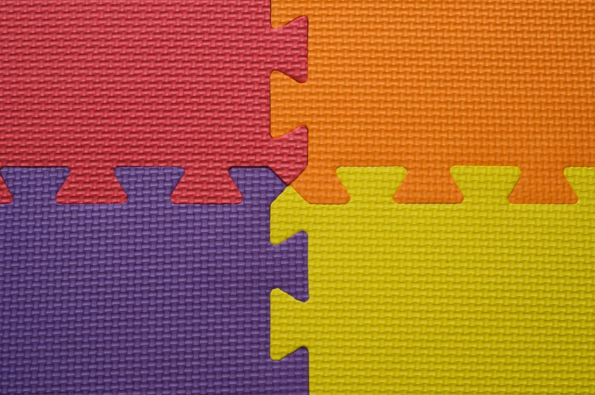 Background of children's multi-colored rug puzzle